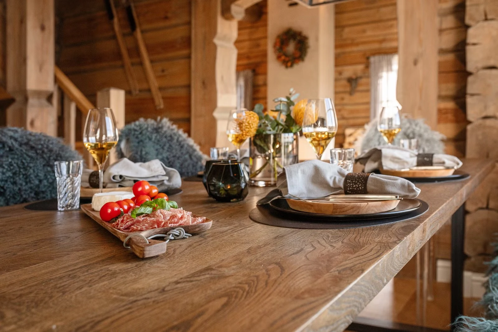 Dining table set for a shared meal at Sprudlebu